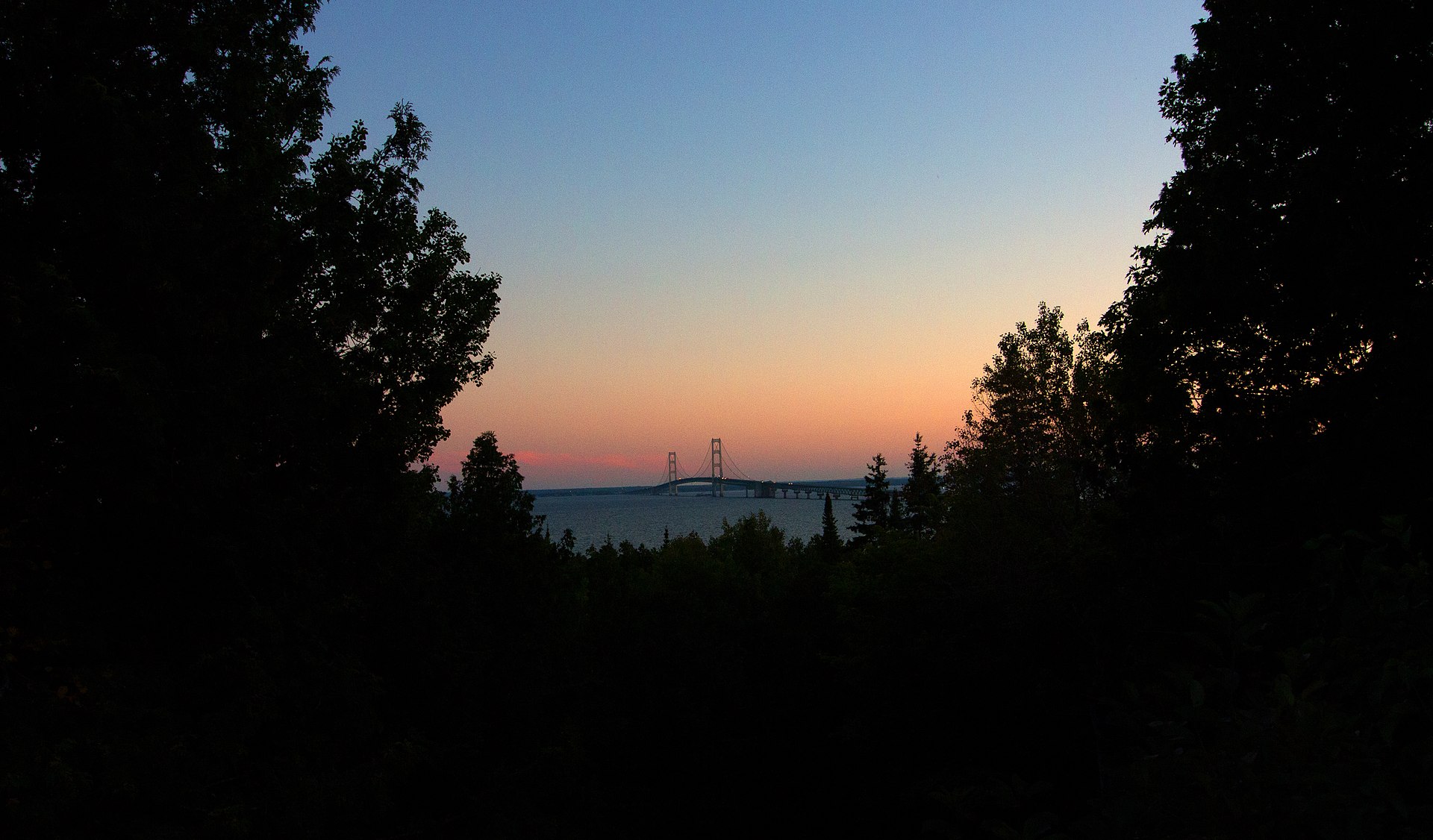 Mackinac Bridge at sunset over the Straits.